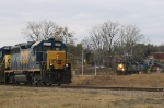 CSX 6350 runs the wye with another unit while a colorful train heads for the yard